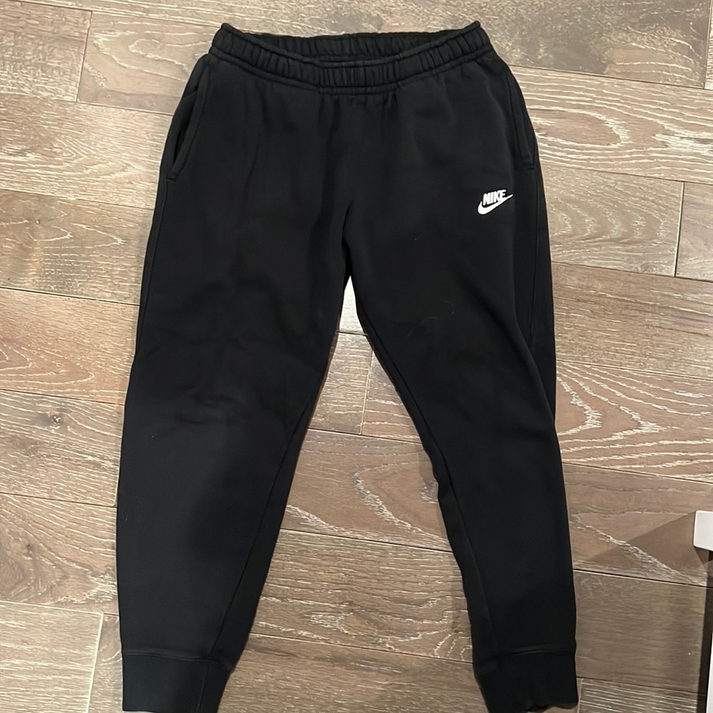 worn, but no holes or rips. nike sweats.
